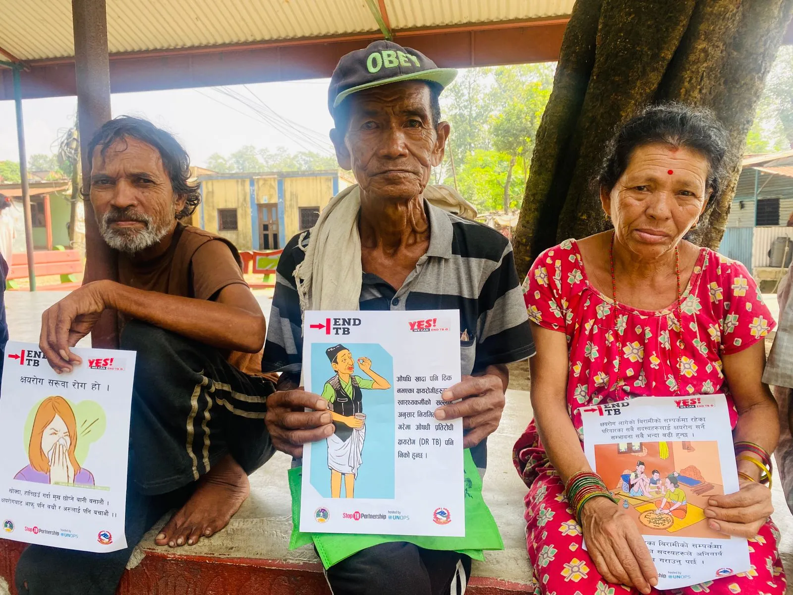 happy peoples with banner against TB